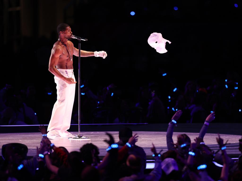 Usher strips during the half-time show. Picture: Getty Images