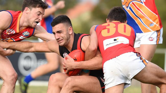 EDFL footy: Pascoe Vale v Maribyrnong Park. (L-R) Maribyrnong Park's Lachlan Doran (21), Pascoe Vale's Dean Soncin (1) and Maribyrnong Park's Alexander Barba (30). Picture: Josie Hayden