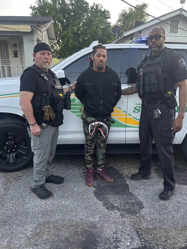 Inmate Robert Moody is flanked by Detective Charles Morgan, left, and Detective Bryant Parish, right, after he was captured in New Orleans on Friday May, 16, 2025. Picture: AP.