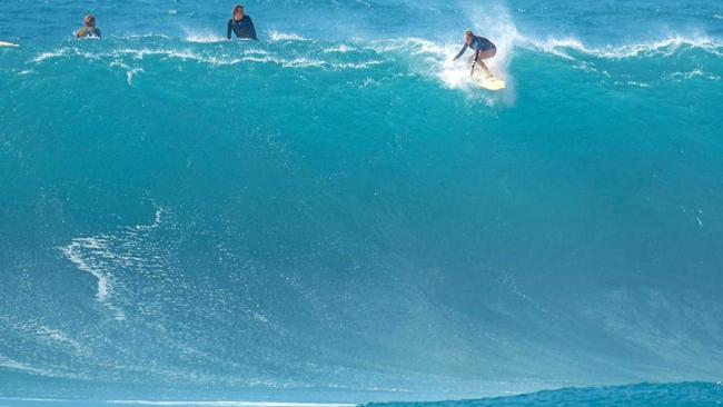 Amarnie Barber ready to drop in on a Waimea Bay monster. Picture: Craig Barber