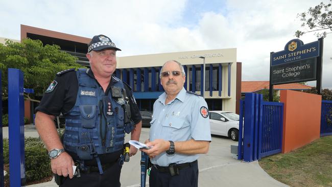 Police Acting Inspector Tony Wormald and Ambulance Senior Operations Supervisor Patrick Berry at St Stephens College in Coomera after seven students were rushed to hospital after a suspected drug overdose. Picture Glenn Hampson