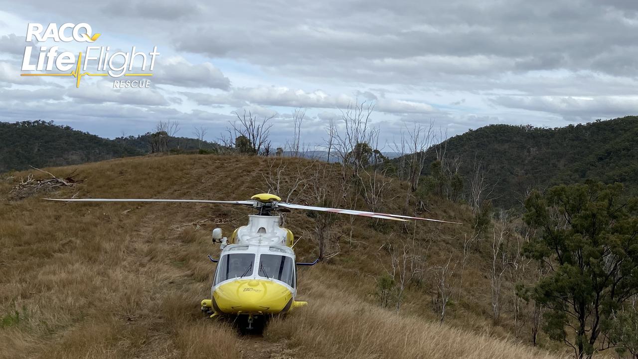 The Toowoomba-based RACQ LifeFlight Rescue helicopter has airlifted a man, who was injured when his bulldozer rolled down a steep mountainside at Booubyjan. Picture: RACQ LifeFlight