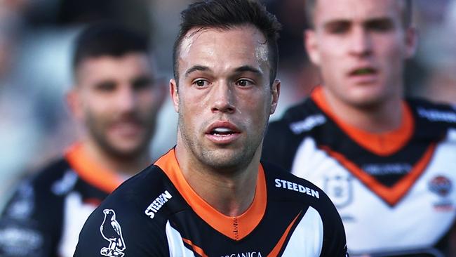 SYDNEY, AUSTRALIA - JUNE 12: Luke Brooks of the Tigers runs with the ball during the round 14 NRL match between the Wests Tigers and the Manly Sea Eagles at Campbelltown Stadium, on June 12, 2022, in Sydney, Australia. (Photo by Matt King/Getty Images)