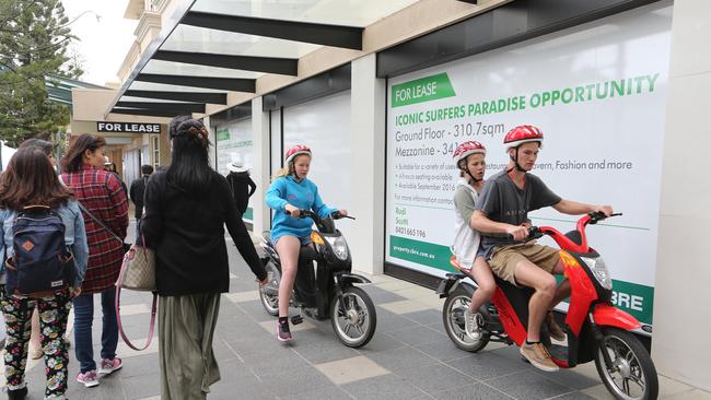 Electric Scooter riders scatter pedestrians on the corner of Elkorn and Cavill Ave. Picture Glenn Hampson