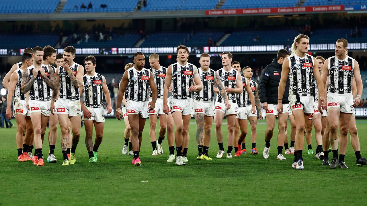 MELBOURNE, AUSTRALIA - JULY 05: The Magpies look dejected after a loss during the 2024 AFL Round 17 match between the Collingwood Magpies and the Essendon Bombers at Melbourne Cricket Ground on July 05, 2024 in Melbourne, Australia. (Photo by Michael Willson/AFL Photos via Getty Images)