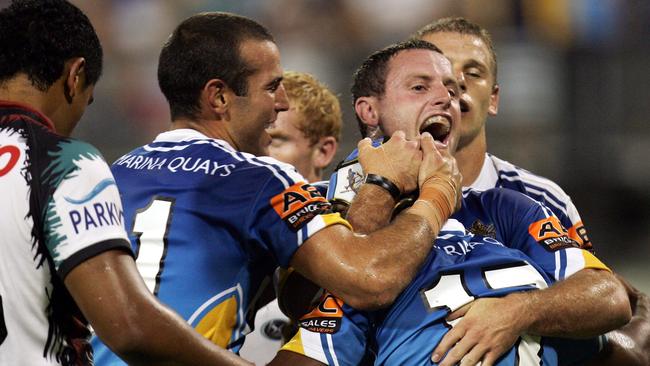 Preston Campbell scored off a Scott Prince grubber kicks and was congratulated by Chris Walker.