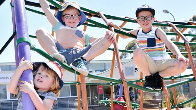 Jonah, Asher and Willem playing on the playground at the Christie Downs Community Centre. Picture: AAP/Morgan Sette