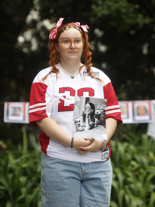 Romany Wake holding a picture of her mother Rachel Wake who was killed in 2021. She Matters – Stop Killing Women Rally at Franklin Square Hobart. Picture: Nikki Davis-Jones