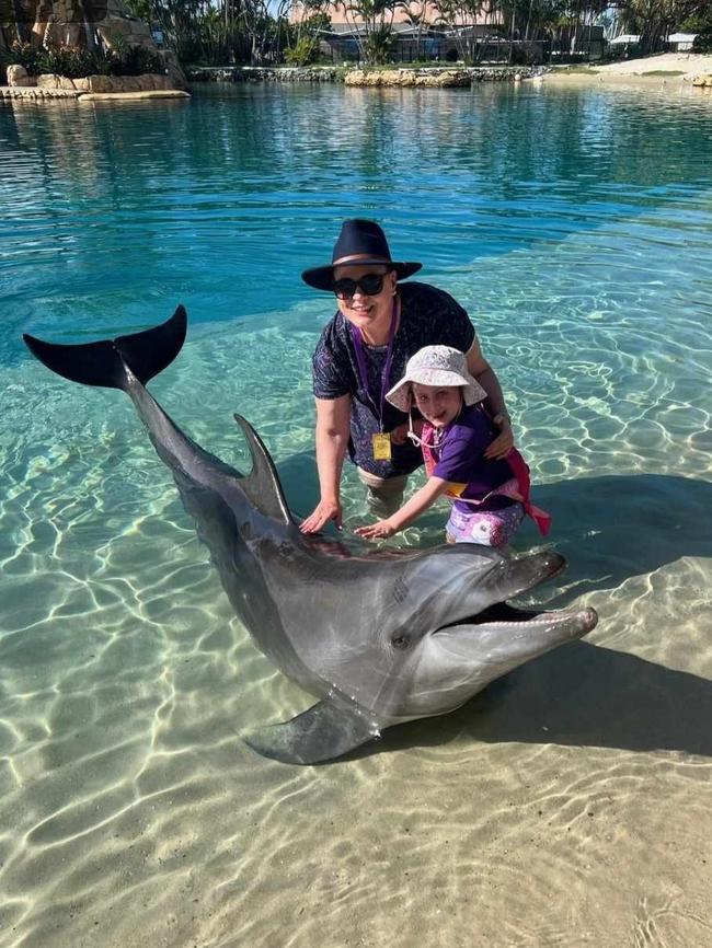 Her Starlight wish saw her meet a dolphin. Picture: Supplied