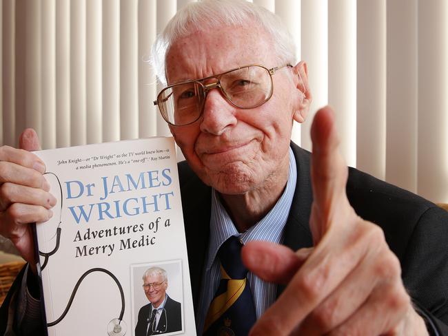 Dr John Knight, aka Merry Medic Dr James Wright, with his autobiography, Adventures of a Merry Medic.