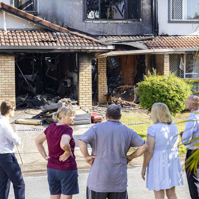 Neighbours at the scene on Monday. Picture: Richard Walker