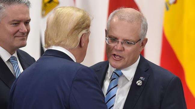 Prime Minister Scott Morrison chats with US President Donald Trump at the G20 Summit last year in Osaka, Japan.