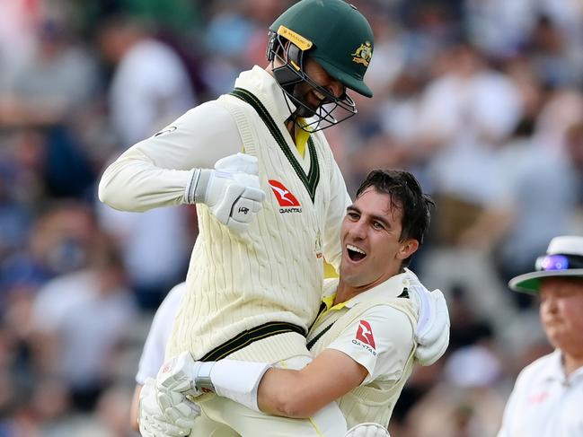 A special moment for Pat Cummins and Nathan Lyon after the most remarkable of victories. Picture: Stu Forster/Getty Images