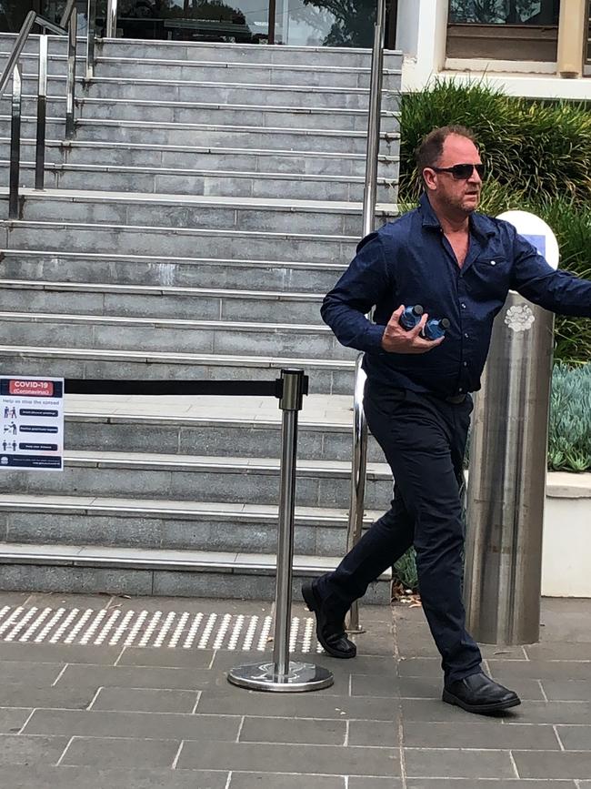 Driver of the mack truck, Mr Sinclair, leaves court on October 20.