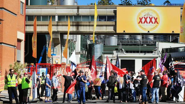 XXXX Brewery workers strike, block trucks from Milton site | The Courier  Mail