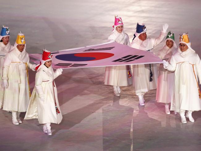 The South Korean flag is carried into the stadium by former athletes. Picture: Ronald Martinez/Getty Images