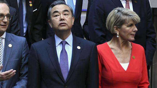 Wang Yi and Julie Bishop pose during the family photo within the G20 foreign ministers' meeting. Picture: AFP