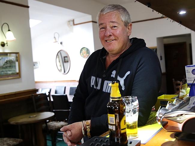 Sad memories ... Nic Clayton, 54, a former mechanical engineer at Anglesey Aluminium in Holyhead having a cider at the Prince of Wales pub. Picture: Ella Pellegrini