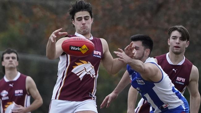 EFL: Whitehorse Pioneers’ Dominic Violi kicks under pressure. Picture: Valeriu Campan