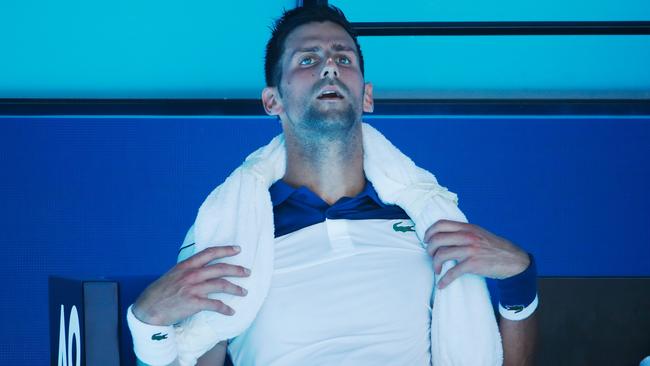 Novak Djokovic — who, despite the appearance of this photo, actually seemed to cope with the heat better than his opponent. (Photo by Scott Barbour/Getty Images)