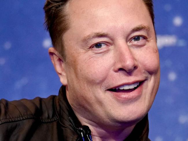 (FILES) In this file photo taken on December 01, 2020, SpaceX owner and Tesla CEO Elon Musk poses as he arrives on the red carpet for the Axel Springer Awards ceremony, in Berlin. - Tesla reported another round of record quarterly profits on January 25, 2023, while confirming its long-term production outlook in spite of concerns about rising competition and macroeconomic headwinds. (Photo by Britta Pedersen / POOL / AFP)