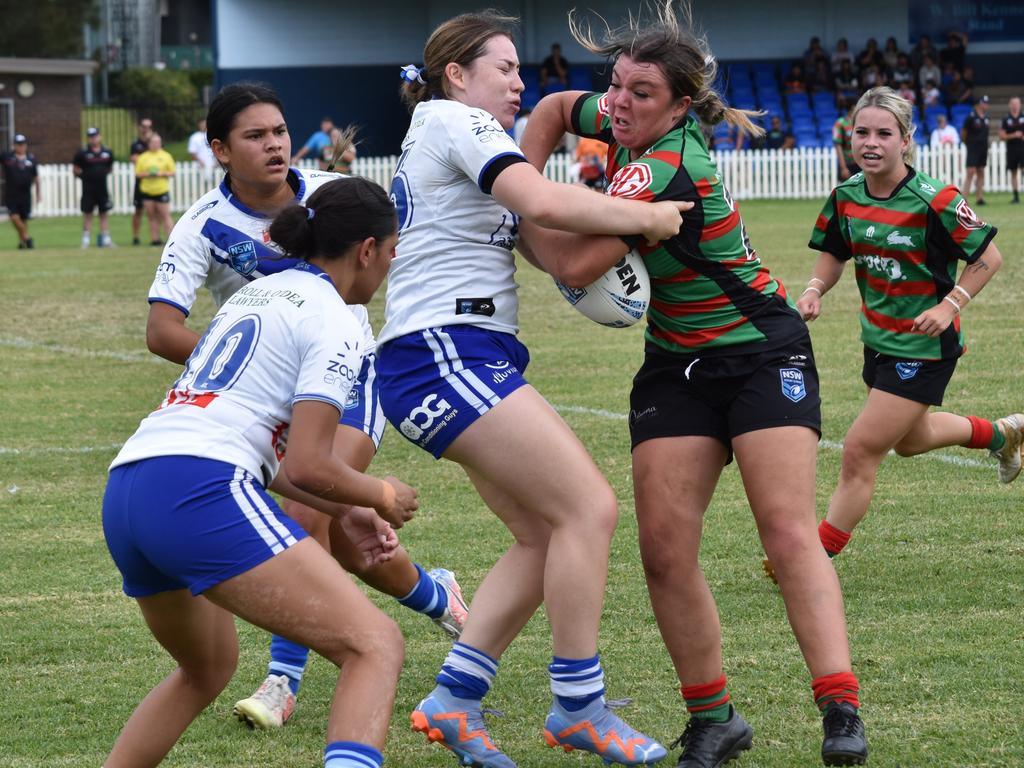 Mackenzie Schoultz is tackled by Abby Aros. Picture: Sean Teuma. Tarsha Gale Cup