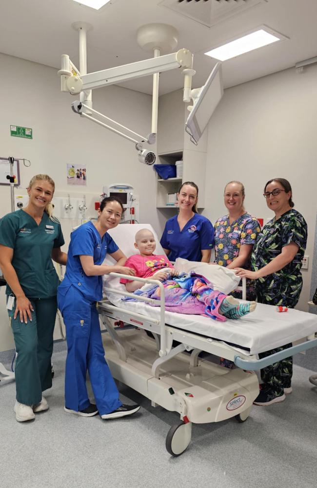 Charlie, after finishing her last round of chemo, with the nurses who’ve cared for her over the years.