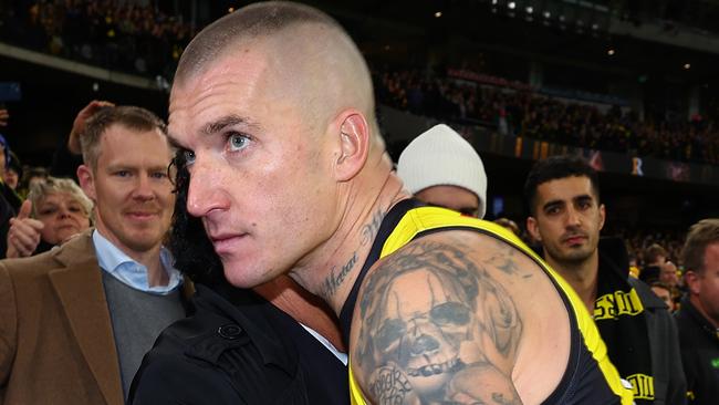 MELBOURNE, AUSTRALIA - JUNE 15: Dustin Martin of the Tigers embraces his agent Ralph Carr following his 300th match the round 14 AFL match between Richmond Tigers and Hawthorn Hawks at Melbourne Cricket Ground on June 15, 2024 in Melbourne, Australia. (Photo by Graham Denholm/Getty Images)