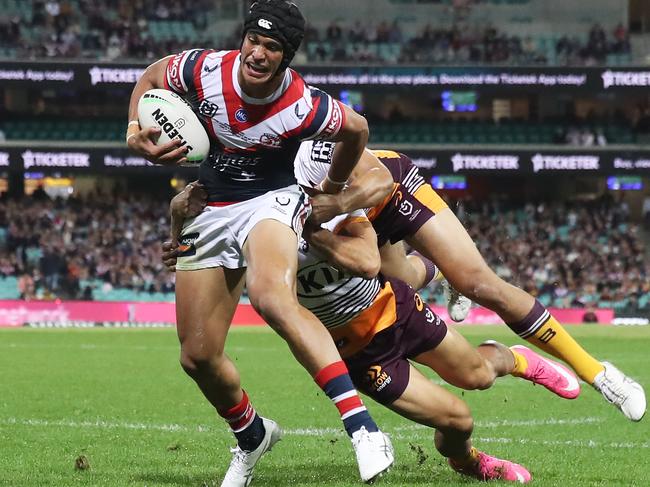 SYDNEY, AUSTRALIA - MAY 22:  Joseph Suaalii of the Roosters is tackled during the round 11 NRL match between the Sydney Roosters and the Brisbane Broncos at Sydney Cricket Ground, on May 22, 2021, in Sydney, Australia. (Photo by Matt King/Getty Images)