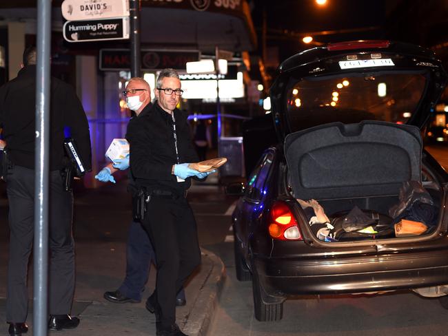 Police collect evidence. Picture: Nicole Garmston