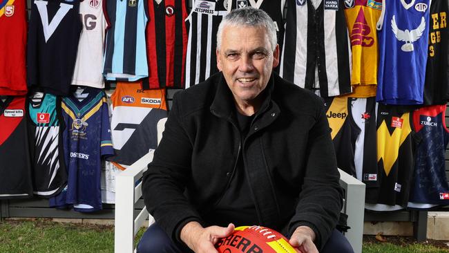 Mark Williams with his collection of football jumpers at his Brighton East home. Picture: Michael Klein.