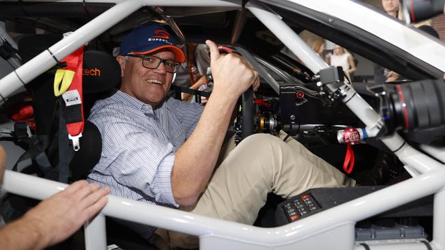 Prime Minister Scott Morrison sitting in the Gen 3 Ford Mustang Supercar while visiting Mount Panorama at the Bathurst 1000. Picture: Tim Hunter.