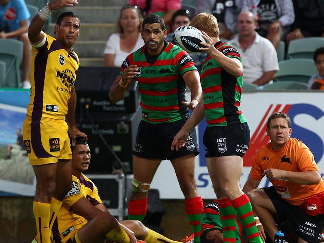 Broncos’ player Justin Hodges and Rabbitoh’s star Greg Inglish motion for urgent medical attention to treat a badly injured Yow Yeh. Picture: Paul Kane