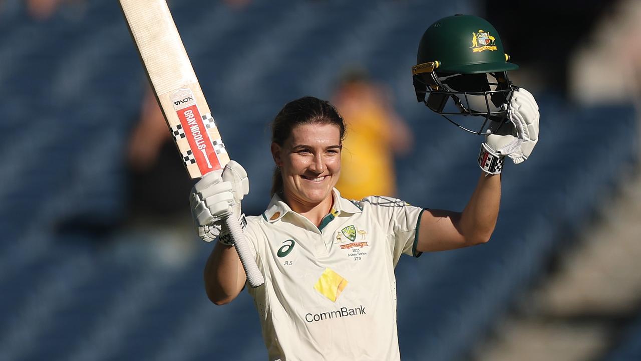 Annabel Sutherland of Australia raises her bat after making a century during day two of the Women's Ashes Test Match between Australia and England at Melbourne Cricket Ground. (Photo by Daniel Pockett/Getty Images)