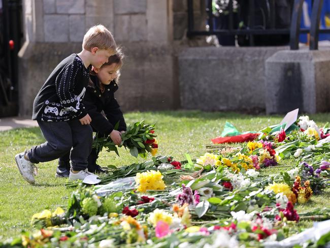 Children lay flowers for Prince Philip at Windsor Castle. Picture: Getty Images