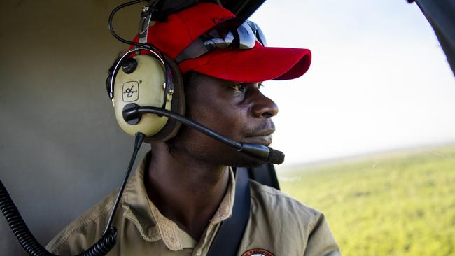 Tiwi Ranger Stanley Tipungwuti undertaking aerial fire management to protect biodiversity, reduce wildfire risk on the Tiwi Islands. Photographer Annette Ruzicka. Courtesy Country Needs People