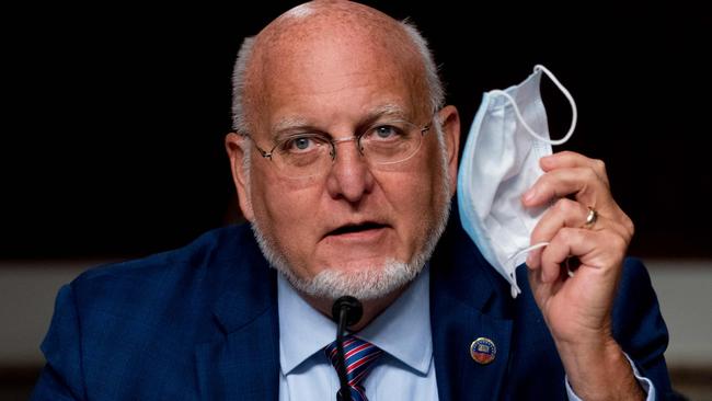 US Centres for Disease Control and Prevention director Dr Robert Redfield holds up his mask during a Senate appropriations subcommittee hearing on coronavirus response efforts last September. Picture: Pool/ AFP