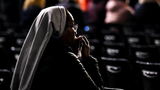 A nun prays for Pope Francis to recover during nightly prayers in St Peter’s Square, Vatican City. Picture: Jacquelin Magnay