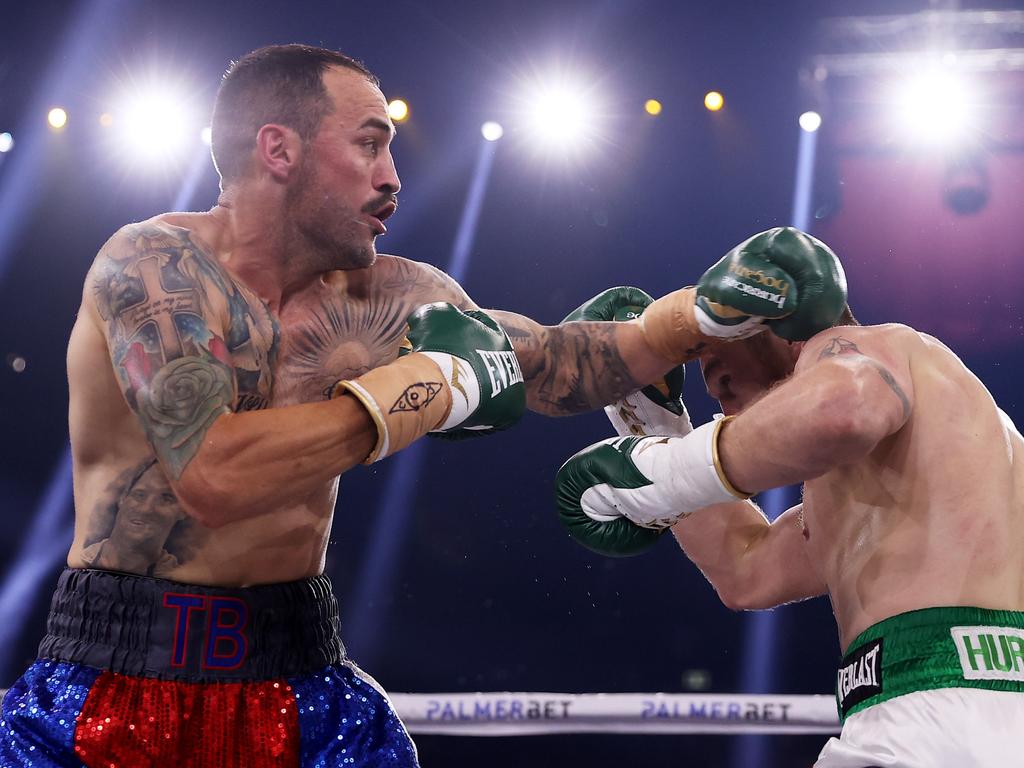 Dennis Hogan (R) and Tommy Browne trade blows in their super welterweight bout. Picture: Mark Kolbe/Getty Images