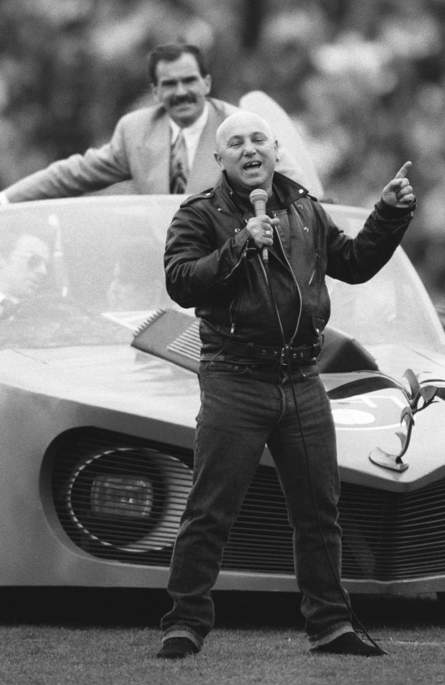 Angry Anderson in front of the Batmobile at the 1991 grand final.