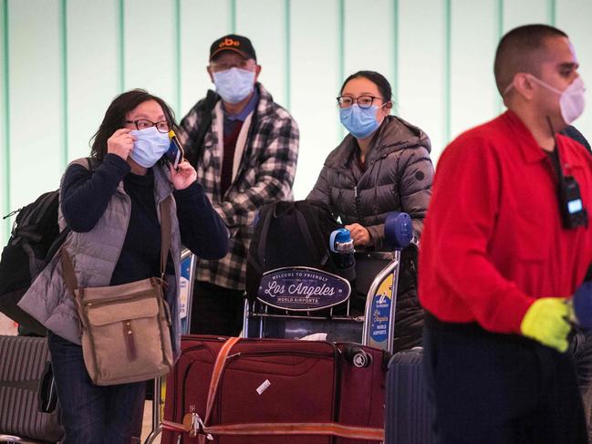 Passengers are wearing face masks to protect against the spread of the coronavirus. Picture: Mark Ralston