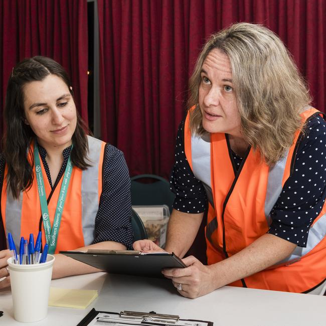 Southern Downs Regional Council community services team members Nicola Featherstone (left) and Sue Organ prepare to welcome Wallangarra residents to the evacuation centre in Stanthorpe, Tuesday, October 31, 2023. Picture: Kevin Farmer