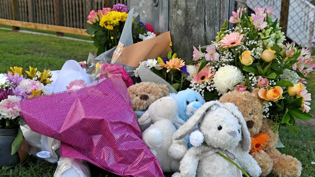 Flowers and cards left at the scene. Picture: AAP/John Gass