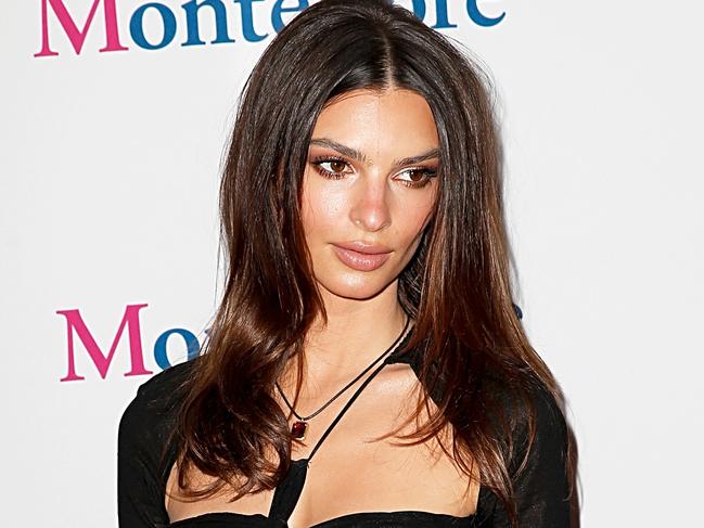 Em Rata flaunts abs in sheer black dress