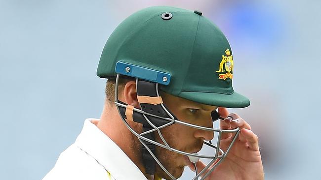 MELBOURNE, AUSTRALIA - DECEMBER 29: Aaron Finch of Australia walks off the field after being dismissed by Jasprit Bumrah of India during day four of the Third Test match in the series between Australia and India at Melbourne Cricket Ground on December 29, 2018 in Melbourne, Australia. (Photo by Quinn Rooney/Getty Images)