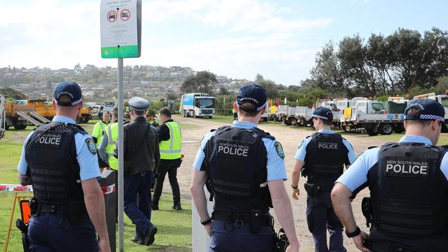 DAILY TELEGRAPH. Police move in to assist Northern Beaches Council workers as the evict and demolishing a camp where people have been living in the dunes at Dee Why Beach. 31/08/2023. Pic by Max Mason-Hubers