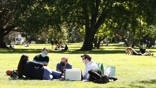 Small picnics like this one are fine, but larger gatherings or where its crowded should be a masked occasion. Pictured: Daniel Pockett/Getty Images