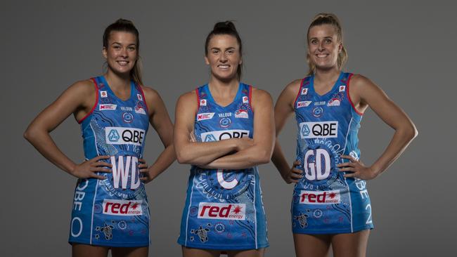 NSW Swifts players Allie Smith, Maddy Proud and Maddy Turner show off their team’s kit. Picture: Narelle Spangher