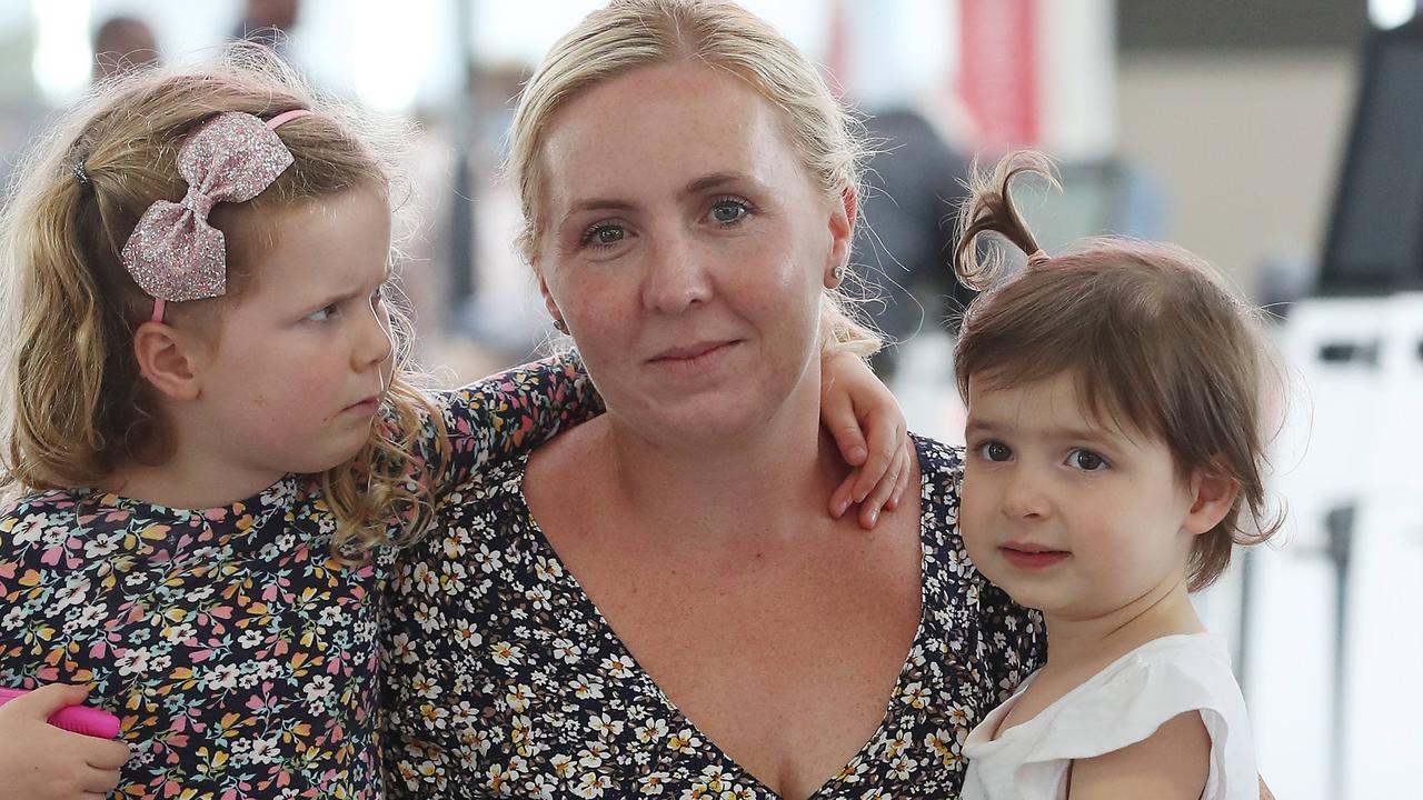 Rebecca Wilkie with her daughters Mackenzie, 4, and Marli, 2, at Sydney airport. Picture: David Swift