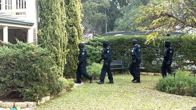 Police undertaking one of the raids.